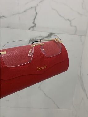 Cartier Rimless Glasses with Gold Details and Red Case